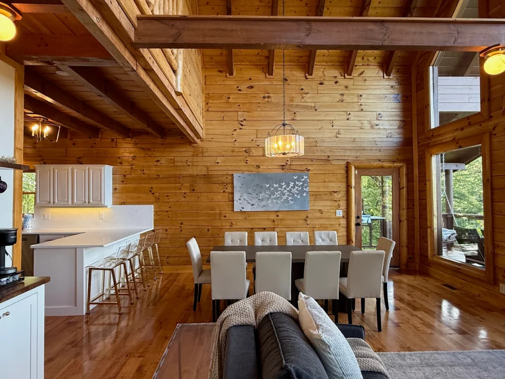 The dining table and breakfast bar share the main-floor gathering space.