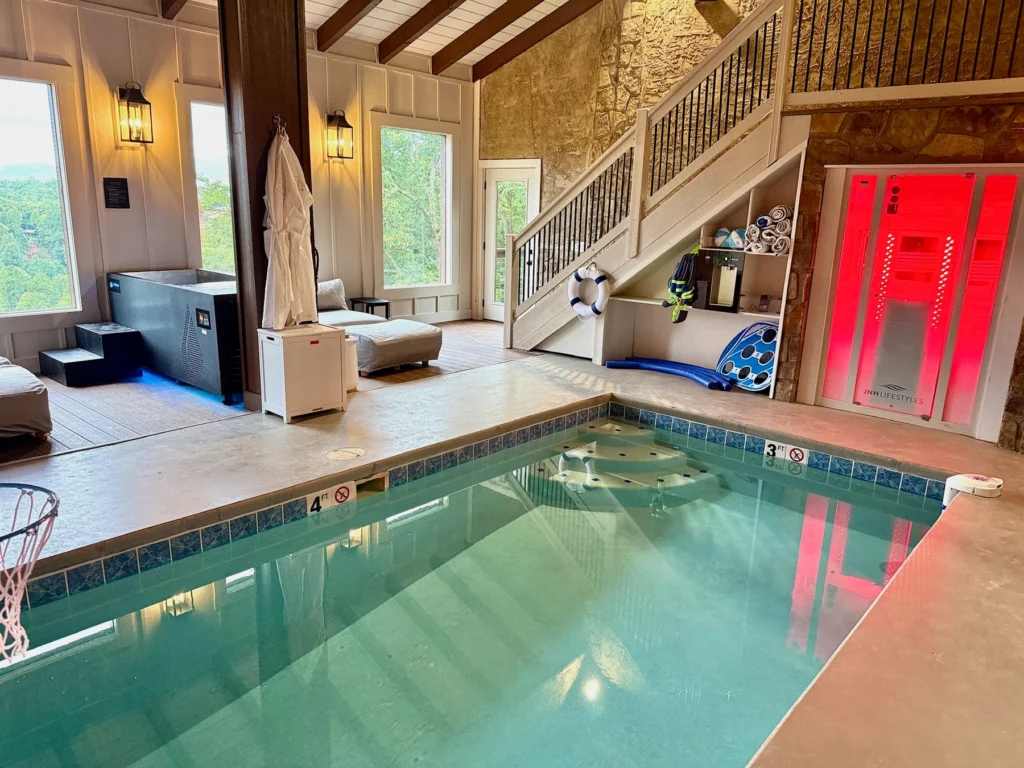 The indoor pool, cold plunge, sauna and lounge seating in one private space.